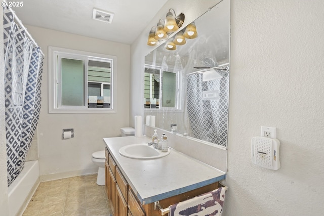 534 N 11th St, Saint Helens, OR 97051 - bathroom featuring vanity, shower / bath combo with shower curtain, tile patterned floors, and a textured wall