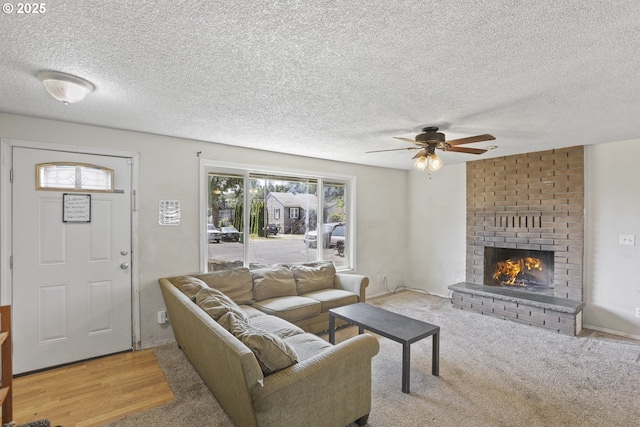 534 N 11th St, Saint Helens, OR 97051 - living area with a ceiling fan, a fireplace, and a textured ceiling