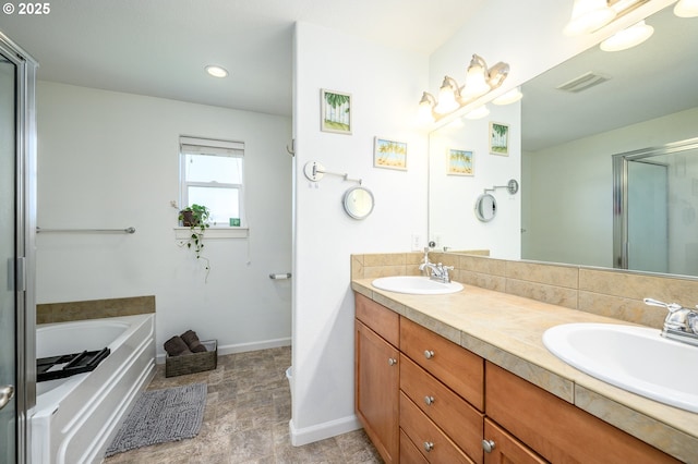 616 E 13th Pl, Lafayette, OR 97127 - bathroom with double vanity, a bath, an enclosed shower, stone finish flooring, and recessed lighting