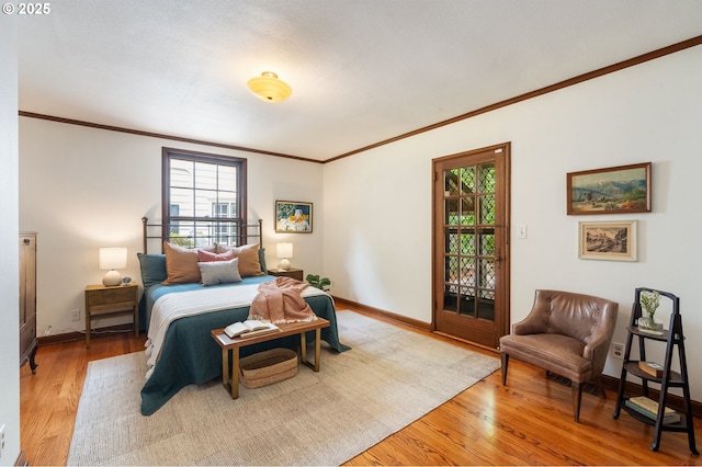 6040 SE 32nd Ave, Portland, OR 97202 - bedroom featuring crown molding, multiple windows, and wood finished floors