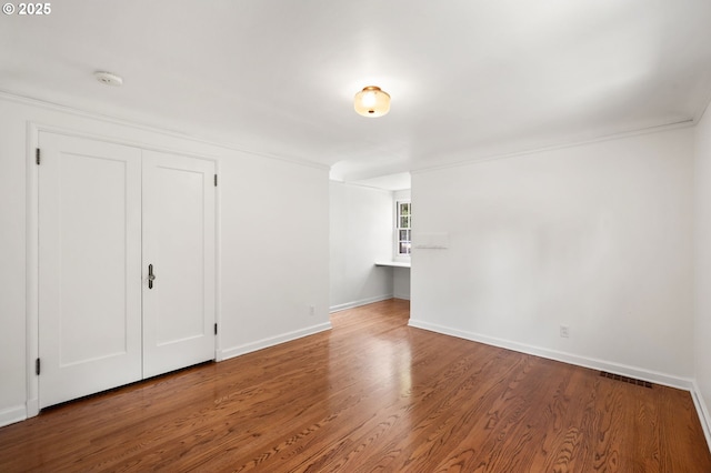 6040 SE 32nd Ave, Portland, OR 97202 - unfurnished living room with wood finished floors and ornamental molding