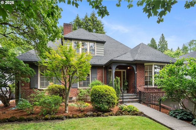6040 SE 32nd Ave, Portland, OR 97202 - view of front of house featuring brick siding, a chimney, roof with shingles, and a front yard