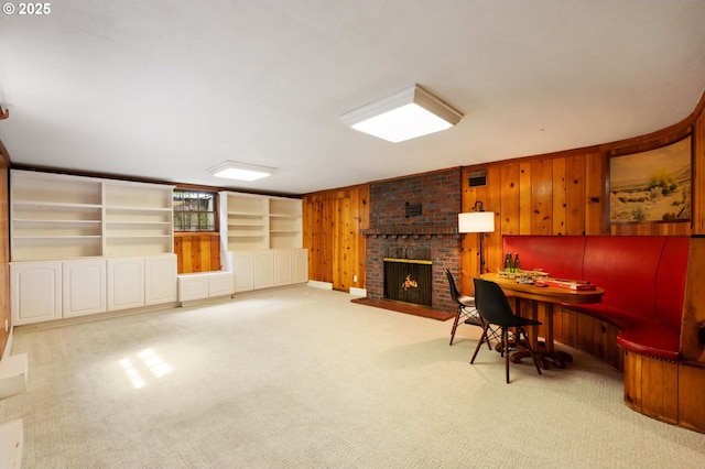 6040 SE 32nd Ave, Portland, OR 97202 - carpeted living room featuring wood walls and a brick fireplace