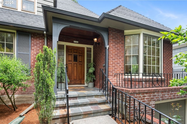 6040 SE 32nd Ave, Portland, OR 97202 - property entrance with a shingled roof and brick siding