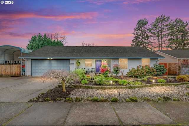 single story home with a garage and a carport