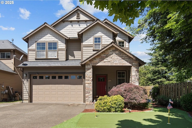 19459 Leland Rd, Oregon City, OR 97045 - view of front facade featuring a putting area, stone siding, asphalt driveway, and an attached garage