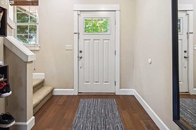 19459 Leland Rd, Oregon City, OR 97045 - foyer entrance featuring dark wood-style flooring, baseboards, and plenty of natural light