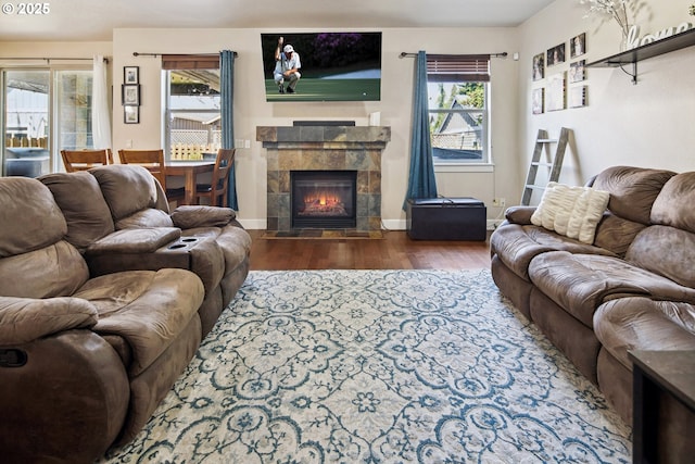 19459 Leland Rd, Oregon City, OR 97045 - living room featuring wood finished floors, healthy amount of natural light, a fireplace, and baseboards