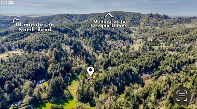 66756 Waymire Rd, North Bend, OR 97459 - birds eye view of property with a wooded view and a mountain view