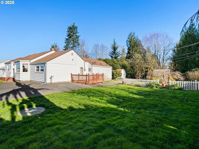 view of yard with a wooden deck