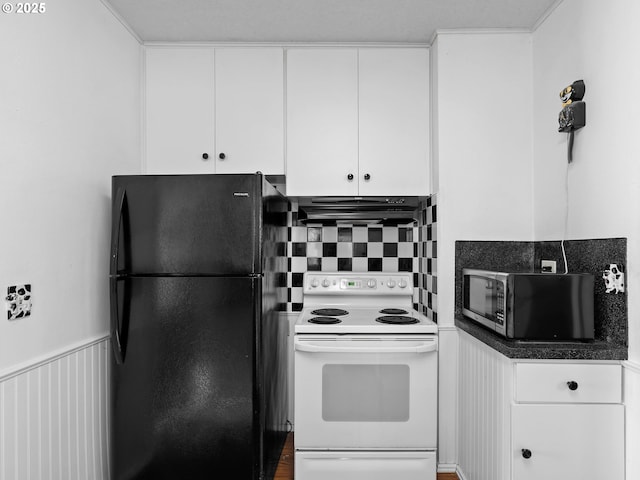 kitchen with black fridge, decorative backsplash, white cabinets, and white electric range oven