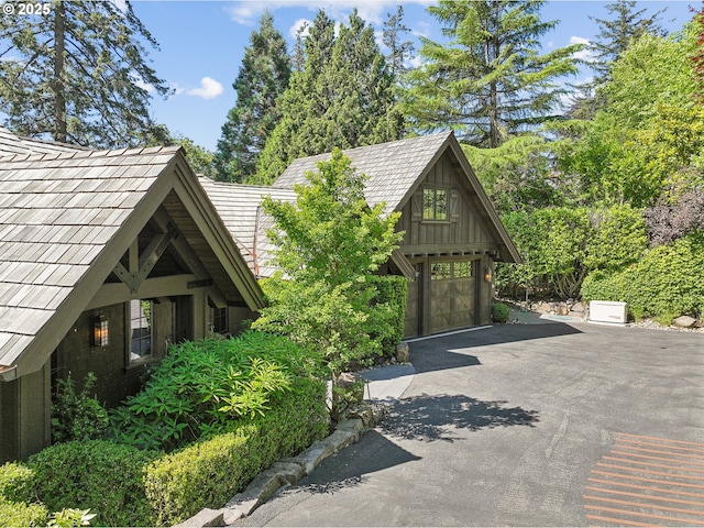 view of side of property featuring a garage