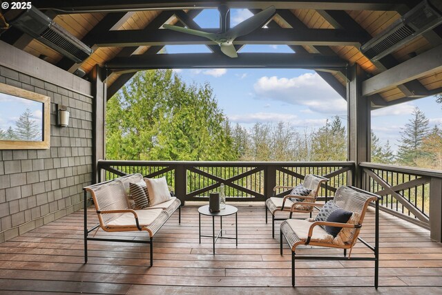 wooden deck with outdoor lounge area and a gazebo