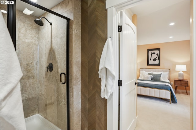 ensuite bathroom featuring ensuite bathroom, recessed lighting, and a stall shower