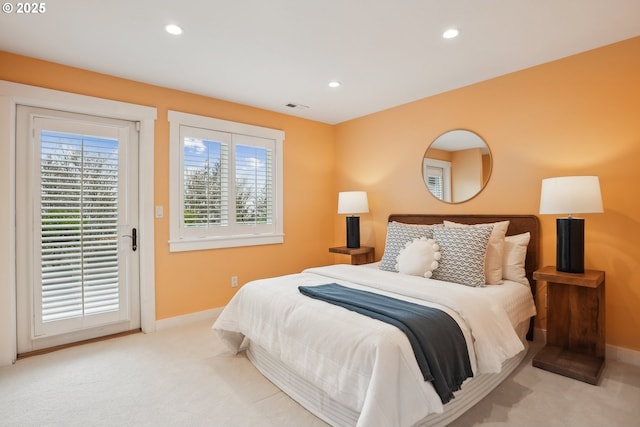 bedroom with carpet floors, baseboards, and visible vents