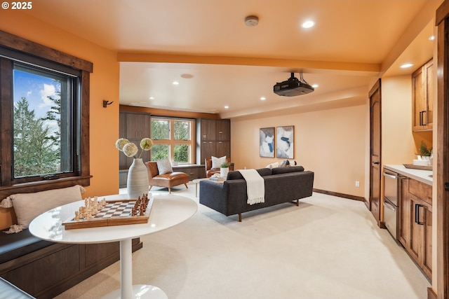 living room featuring baseboards, recessed lighting, and light carpet