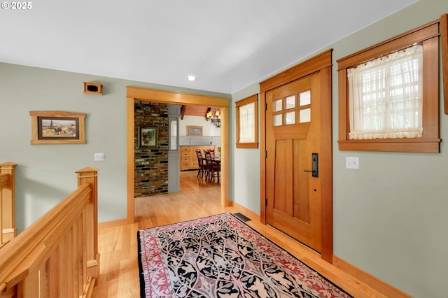 24780 Lavell Rd, Junction City, OR 97448 - entrance foyer with light wood-style flooring, ornate columns, recessed lighting, and baseboards
