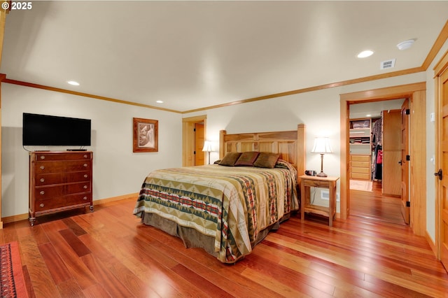 24780 Lavell Rd, Junction City, OR 97448 - bedroom with wood-type flooring, crown molding, baseboards, and recessed lighting