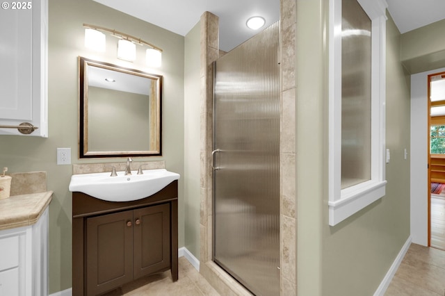 24780 Lavell Rd, Junction City, OR 97448 - bathroom with vanity, a shower stall, baseboards, and tile patterned floors
