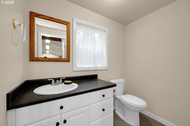 24780 Lavell Rd, Junction City, OR 97448 - half bathroom featuring vanity, toilet, and baseboards