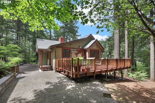 24780 Lavell Rd, Junction City, OR 97448 - rear view of property featuring a chimney, a wooden deck, and a shingled roof