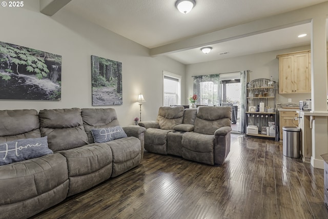 living room with dark wood finished floors and beamed ceiling