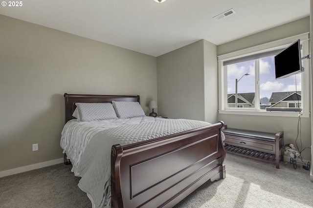 bedroom featuring baseboards, visible vents, and carpet flooring