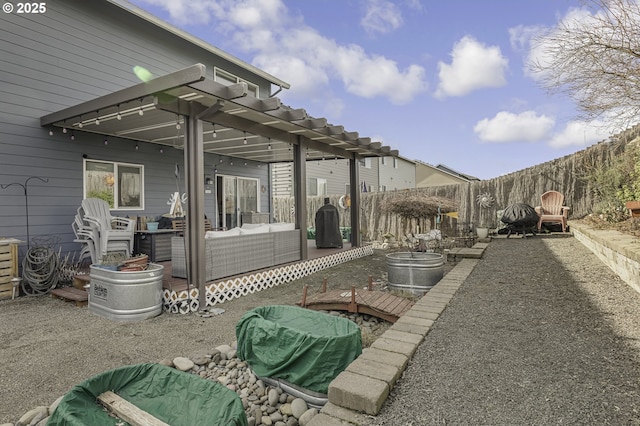 view of patio with a fenced backyard, a pergola, and a wooden deck