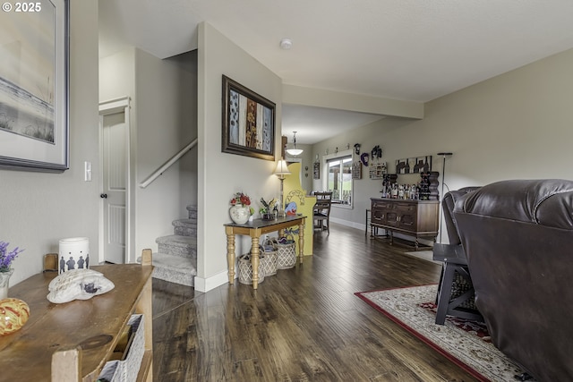 interior space with dark wood-style floors, stairway, and baseboards