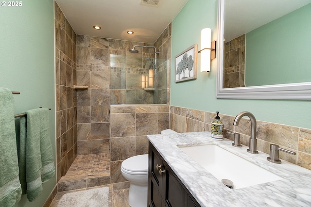 bathroom with walk in shower, toilet, vanity, and recessed lighting