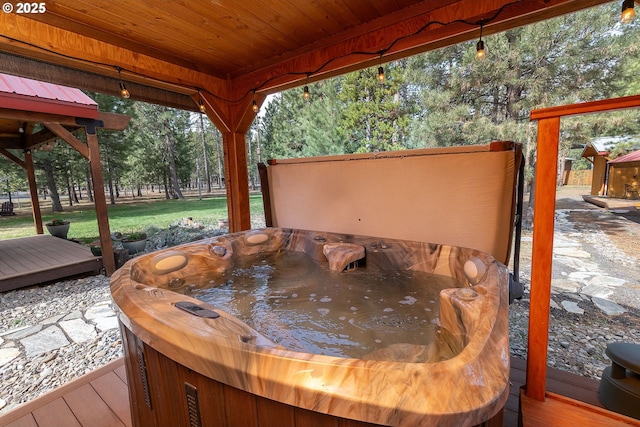 deck featuring a hot tub