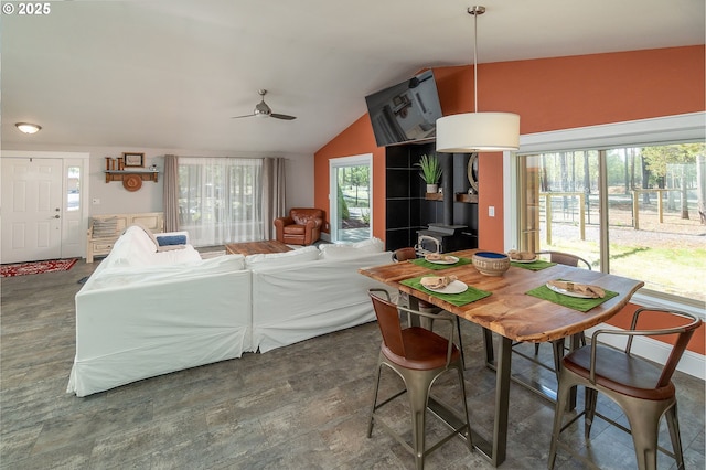 dining room featuring vaulted ceiling and a ceiling fan