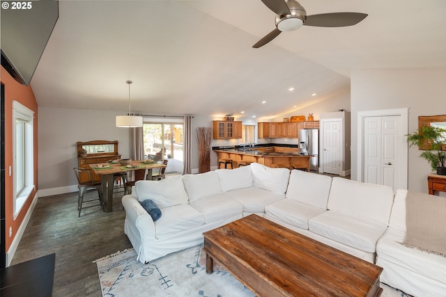 living area featuring lofted ceiling, ceiling fan, dark wood-style floors, recessed lighting, and baseboards