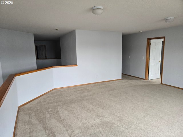 12174 SW Quail Creek Ln, Portland, OR 97223 - carpeted empty room with baseboards