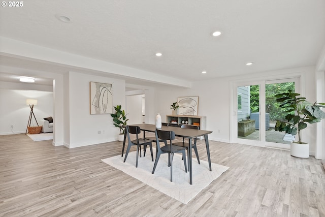 dining area featuring light wood-style floors, baseboards, and recessed lighting
