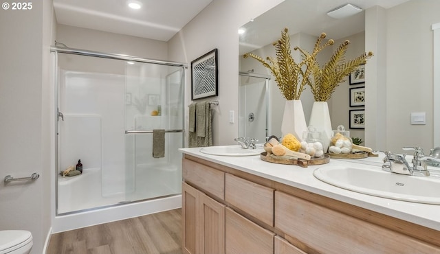6155 SE 16th St, Gresham, OR 97080 - bathroom featuring a stall shower, double vanity, wood finished floors, and recessed lighting