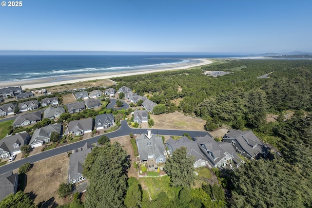 aerial view featuring a view of the beach and a water view