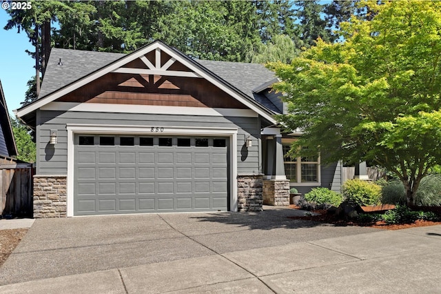 850 NW 114th Ave, Portland, OR 97229 - craftsman inspired home featuring stone siding, driveway, an attached garage, and a shingled roof