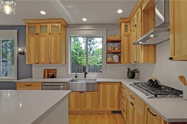 850 NW 114th Ave, Portland, OR 97229 - kitchen featuring wall chimney range hood, stainless steel appliances, a sink, healthy amount of natural light, and recessed lighting