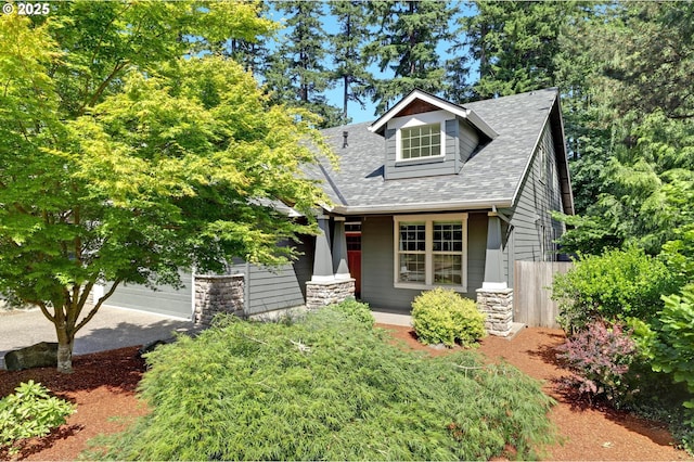 850 NW 114th Ave, Portland, OR 97229 - view of front of house with roof with shingles, a porch, and driveway