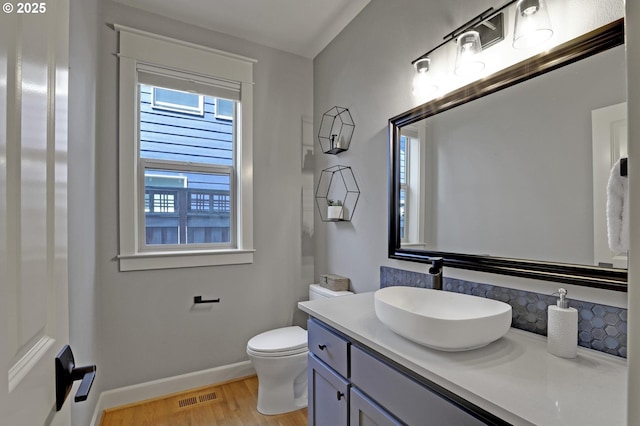 850 NW 114th Ave, Portland, OR 97229 - bathroom with wood finished floors, baseboards, vanity, and toilet