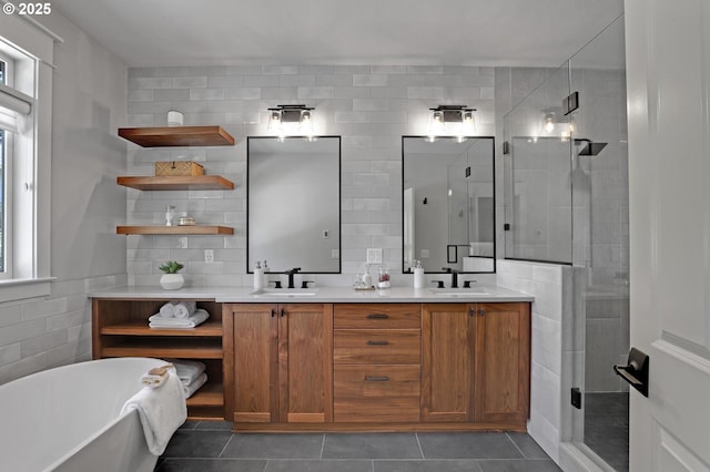 850 NW 114th Ave, Portland, OR 97229 - bathroom featuring tile walls, a soaking tub, a stall shower, double vanity, and tile patterned flooring