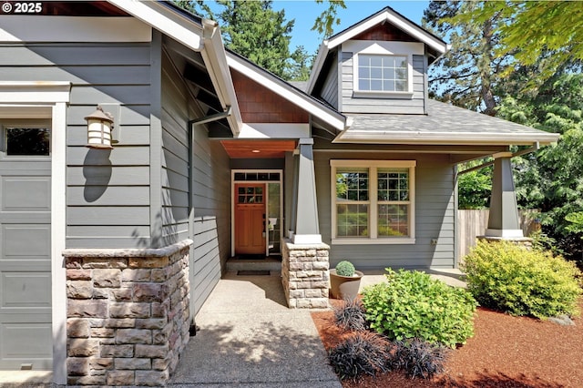 850 NW 114th Ave, Portland, OR 97229 - property entrance featuring covered porch, stone siding, and roof with shingles
