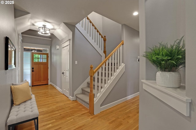 850 NW 114th Ave, Portland, OR 97229 - foyer entrance with light wood finished floors, stairway, baseboards, and vaulted ceiling