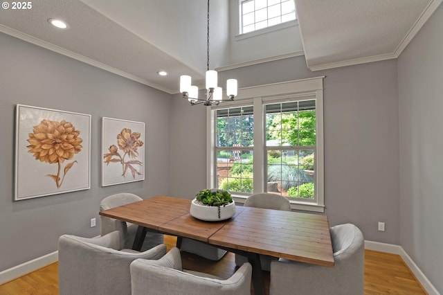 850 NW 114th Ave, Portland, OR 97229 - dining space with a chandelier, crown molding, light wood-style floors, baseboards, and recessed lighting