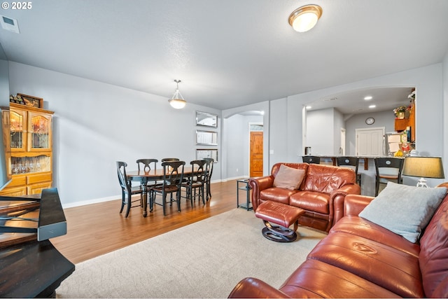 living room with light hardwood / wood-style flooring