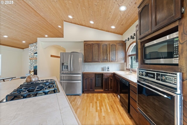 54601 Winterberry Dr, Bandon, OR 97411 - kitchen featuring black appliances, wood ceiling, a sink, lofted ceiling, and recessed lighting