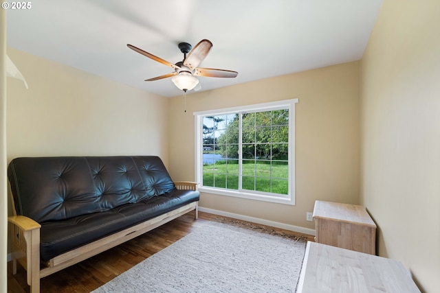 54601 Winterberry Dr, Bandon, OR 97411 - living area featuring baseboards, wood finished floors, and a ceiling fan