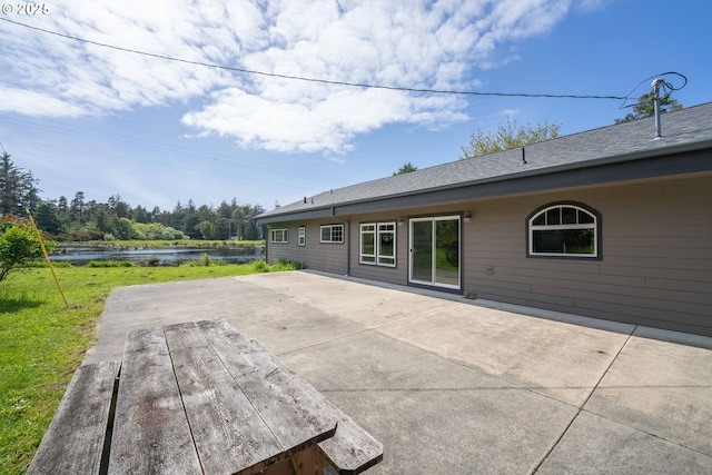 54601 Winterberry Dr, Bandon, OR 97411 - view of patio with a water view