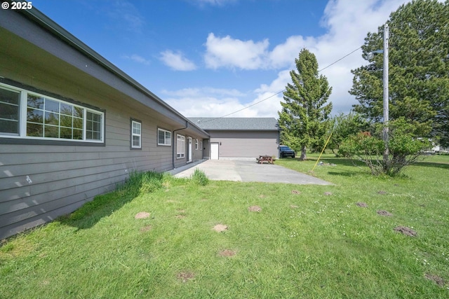 54601 Winterberry Dr, Bandon, OR 97411 - view of green lawn featuring a patio area